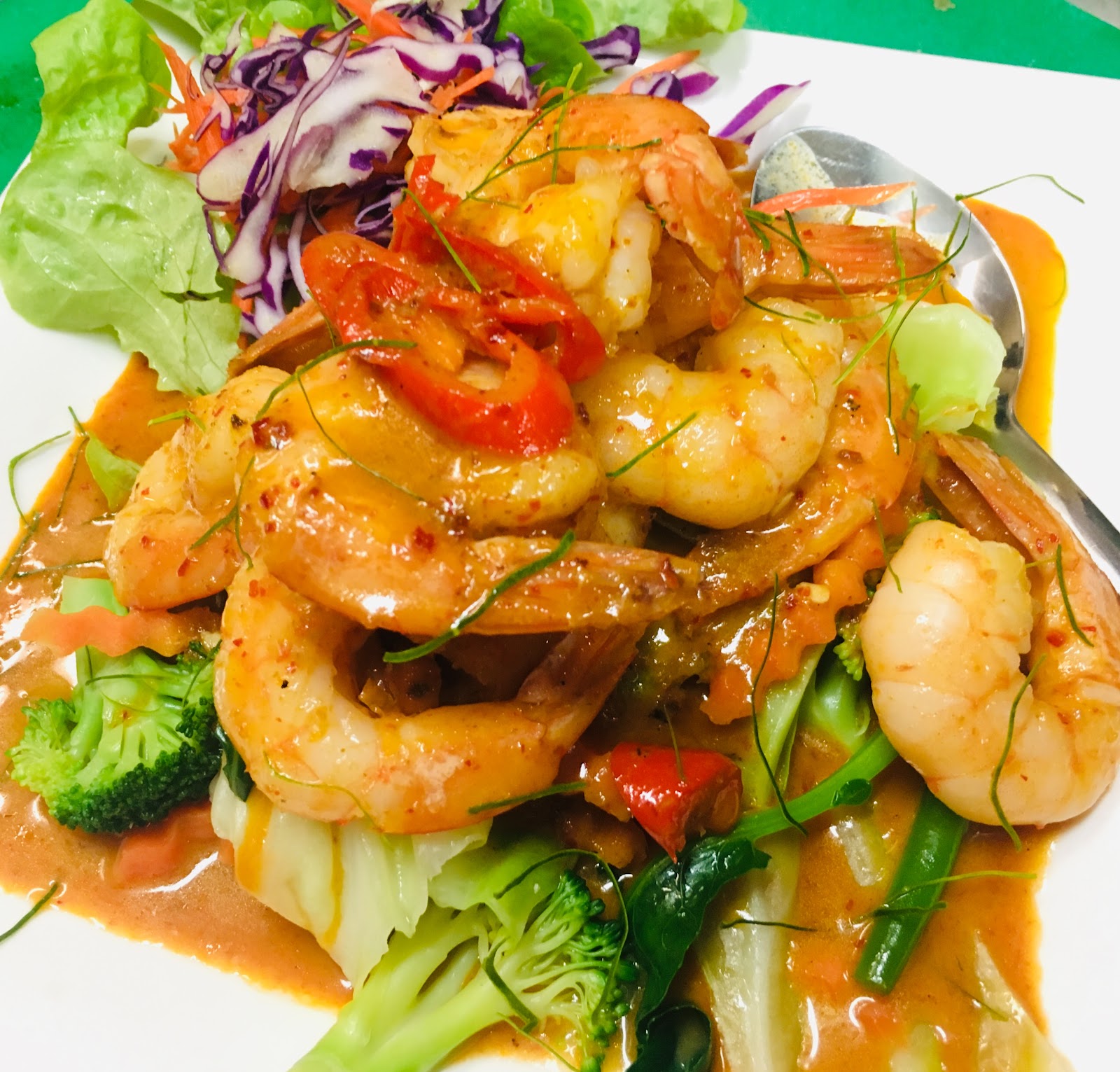 Prawns in a red curry sauce with broccoli